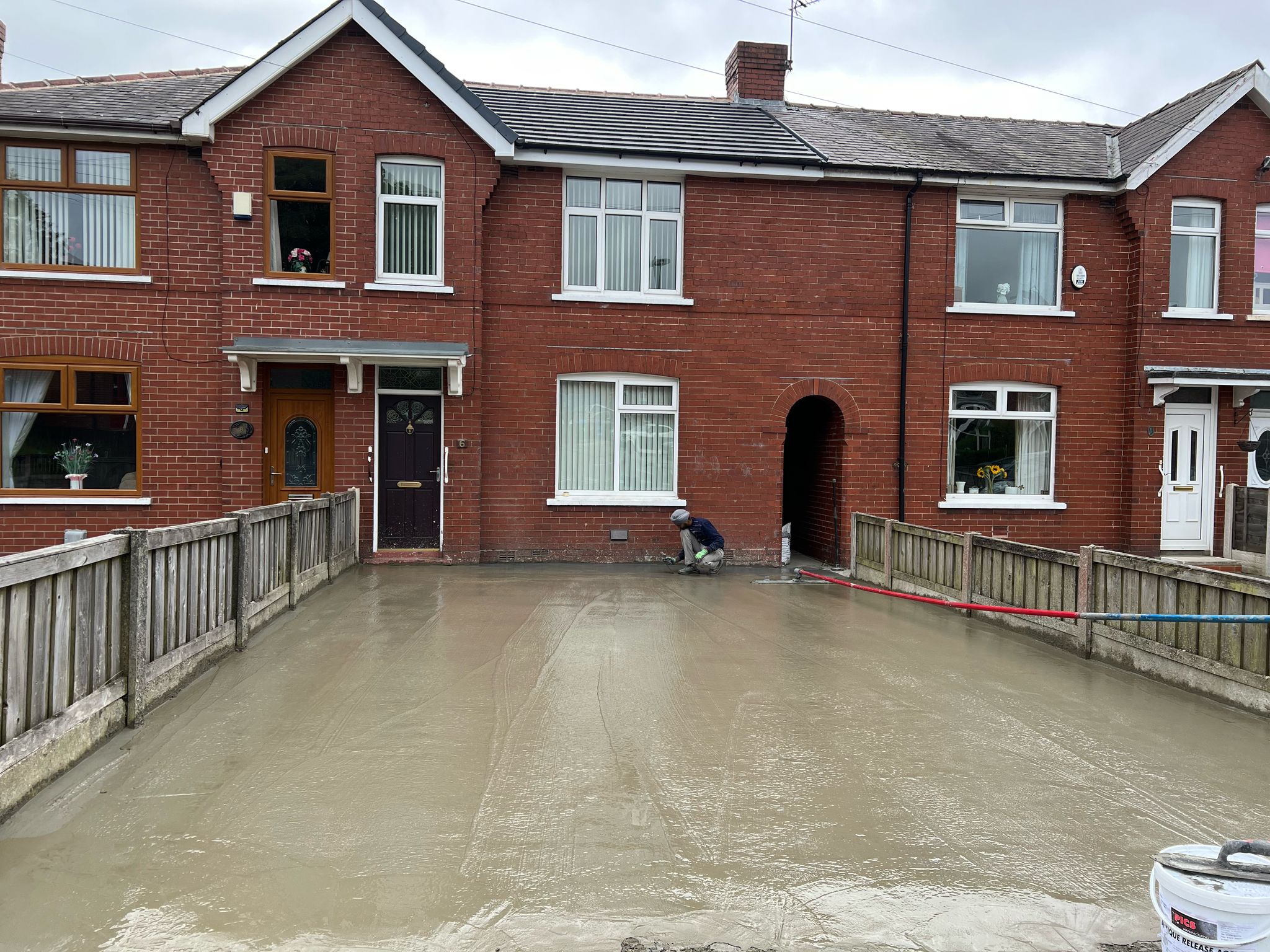 plain, freshly poured concrete driveway